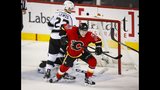 Carter scores in OT, Kings beat Flames 5-4