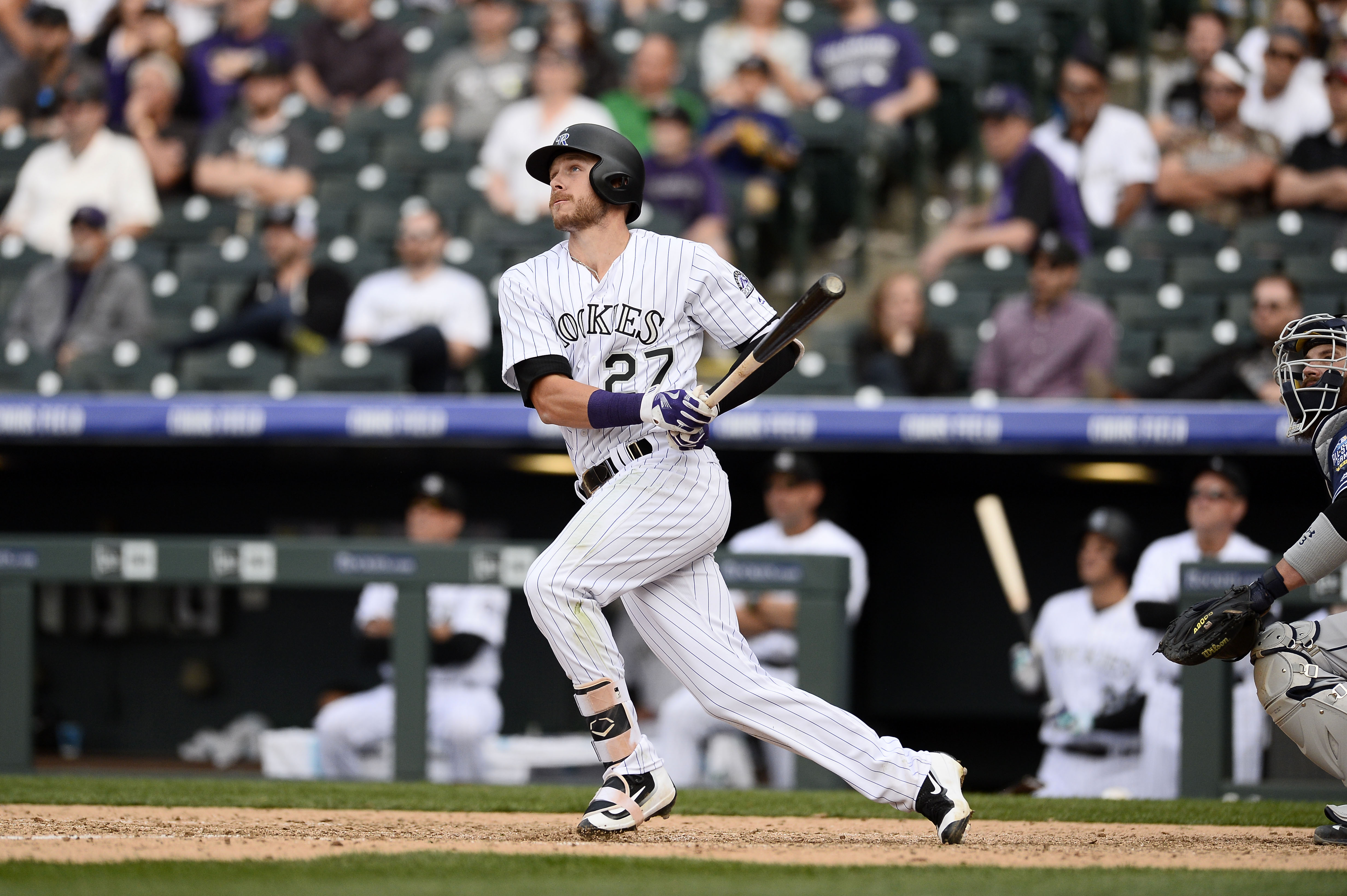 Colorado Rockies' Trevor Story looks skyward as he arrives home after  hitting a solo home run during the eighth inning of the team's baseball  game against the St. Louis Cardinals on Tuesday