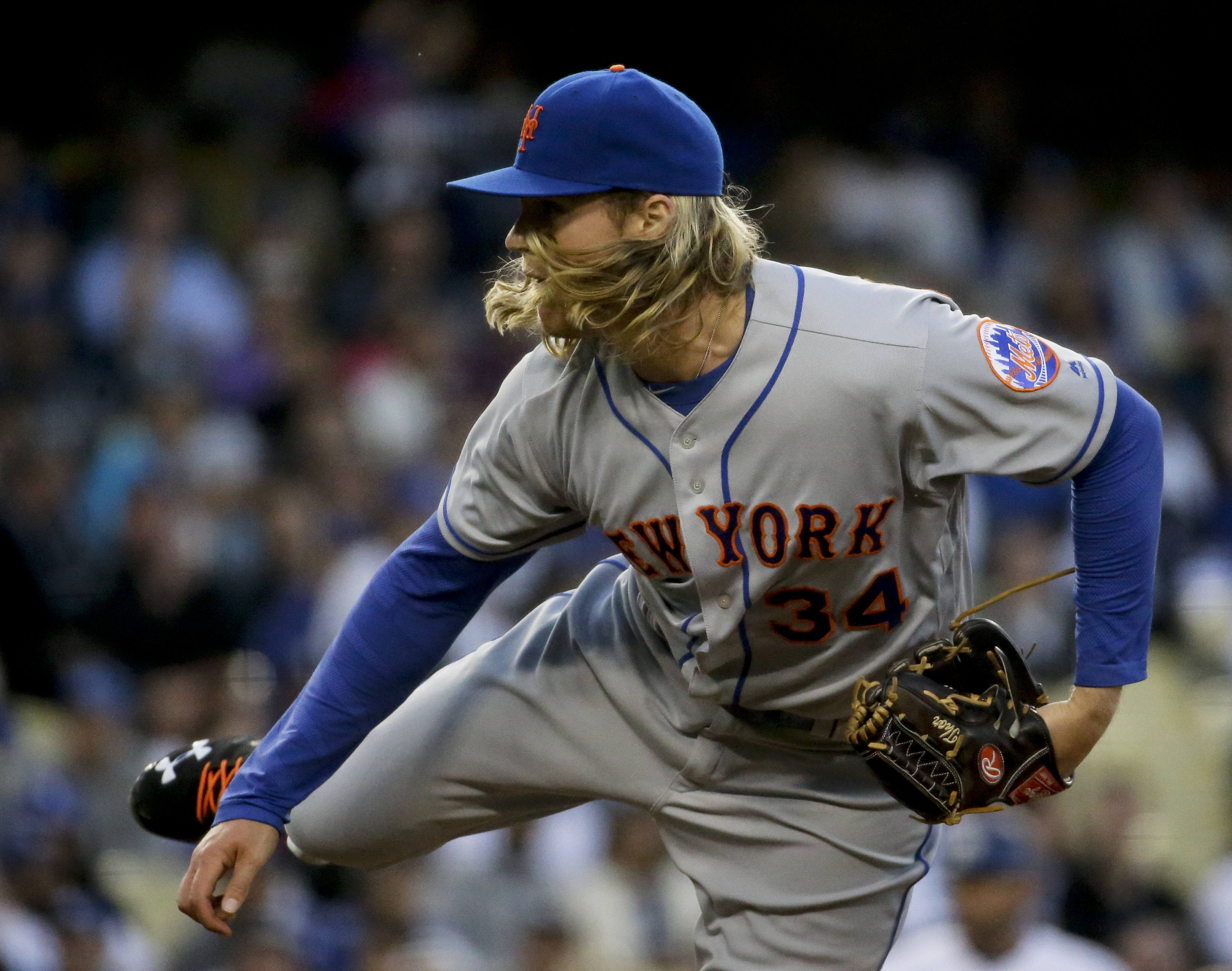 New York Mets manager Terry Collins, left, pulls relief pitcher