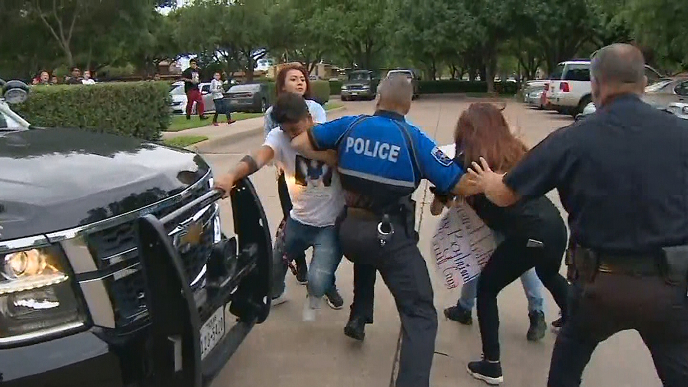 Crowd takes over Texas city hall to protest police shooting of teen