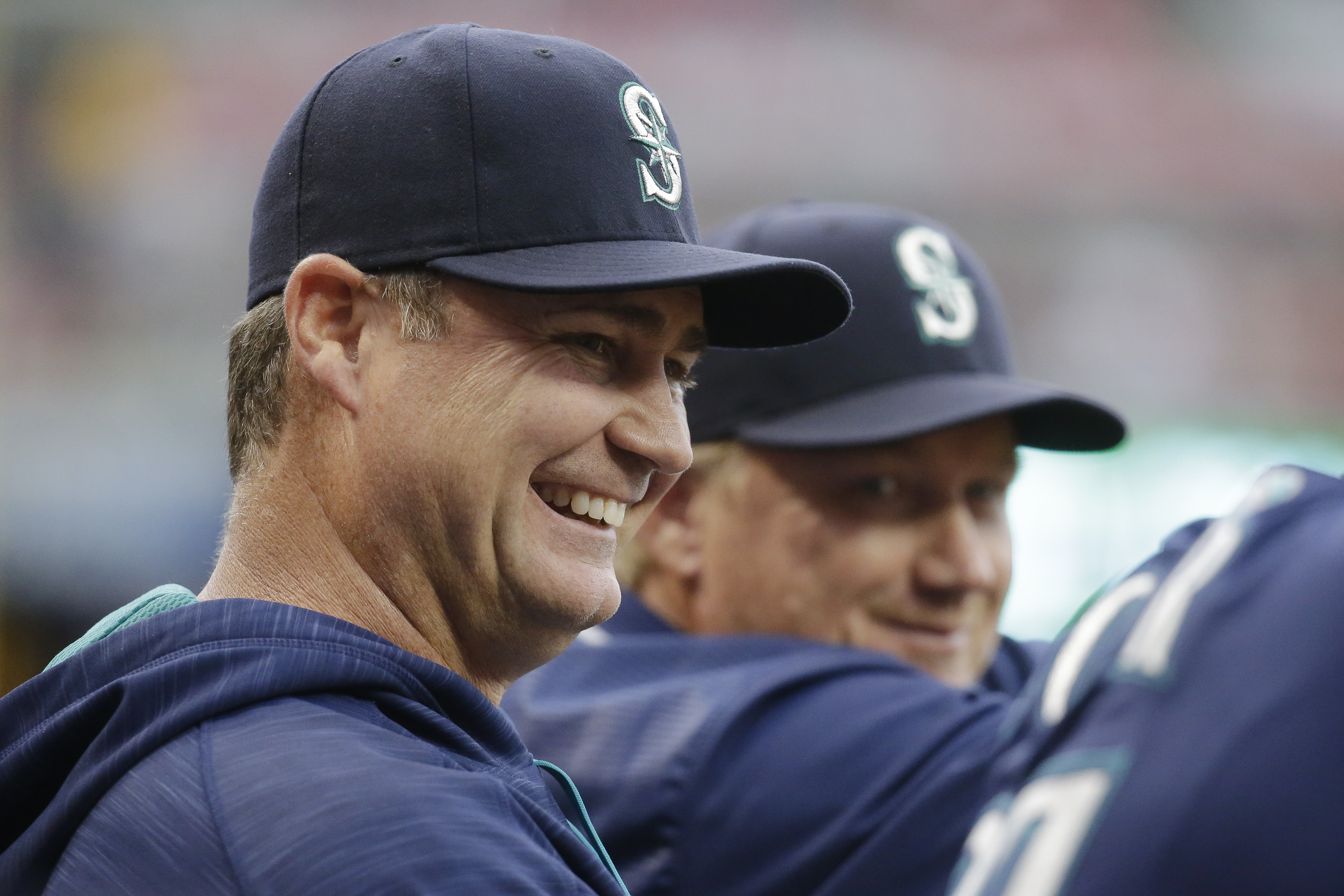 Seattle Mariners' Franklin Gutierrez, right, celebrates with Felix  Hernandez, second from left, and teammates in the dugout after hitting a  three-run home run off Cincinnati Reds starting pitcher John Lamb in the