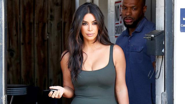 Kim Kardashian shows off her tiny waist and long legs in skintight