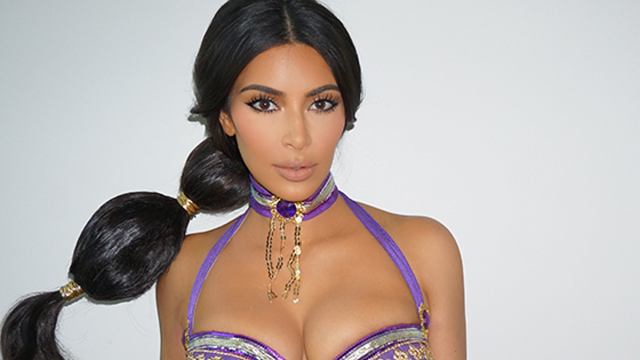 Kim Kardashian Flaunts Major Cleavage on Book Cover