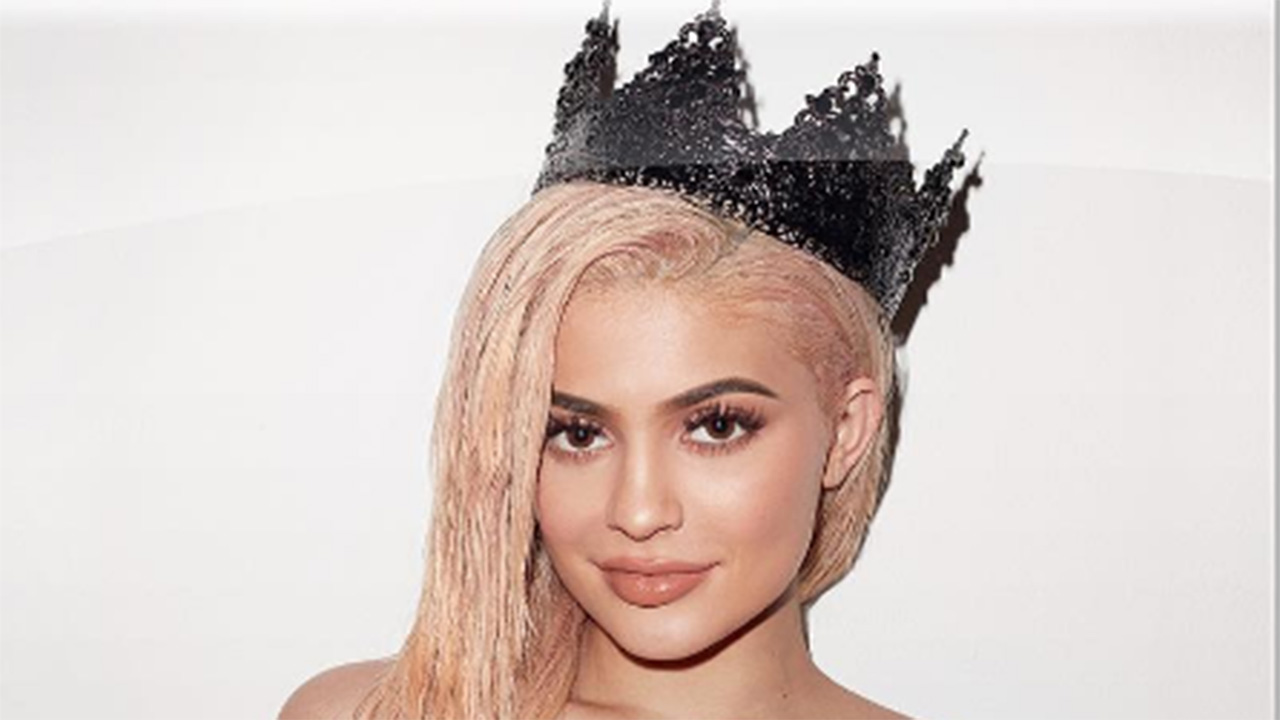 Kylie Jenner Poses With a Giant Snake in Racy New Calendar Shot by