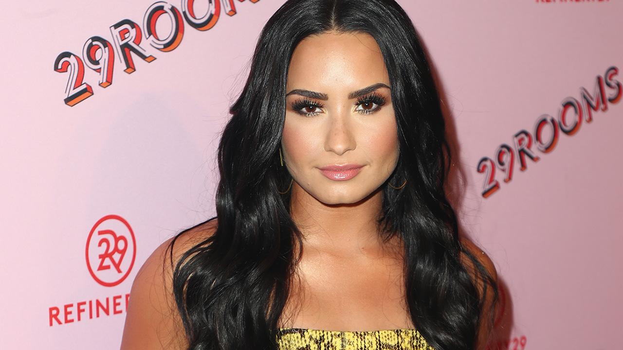 Demi Lovato Puts Cleavage On Display In Steamy Pool Snaps